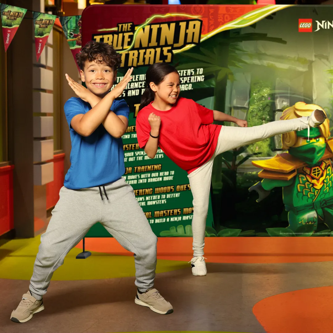 Two Children showing off their ninja moves at LEGOLAND Discovery Center